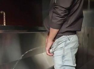 Man pisses in the toilet and plays with his piss