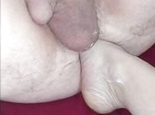 Foot in husband's ass