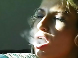Blonde is smoking a cigarette so sexy